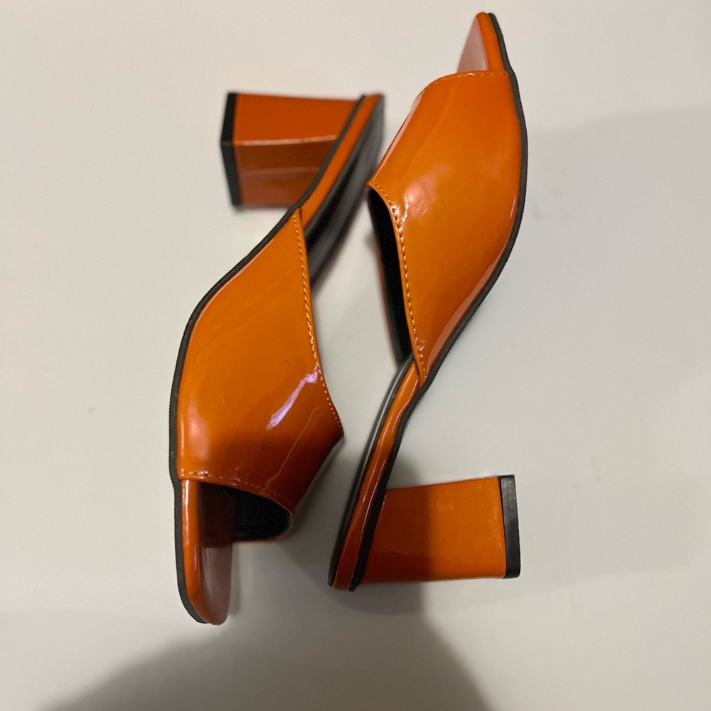 Burnt orange mules. Mid heels.